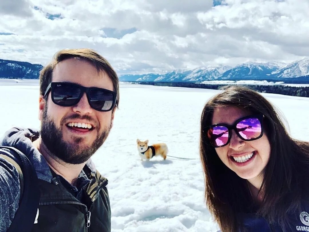Rob, his wife, and their dog Corgus in Grand Teton National Park